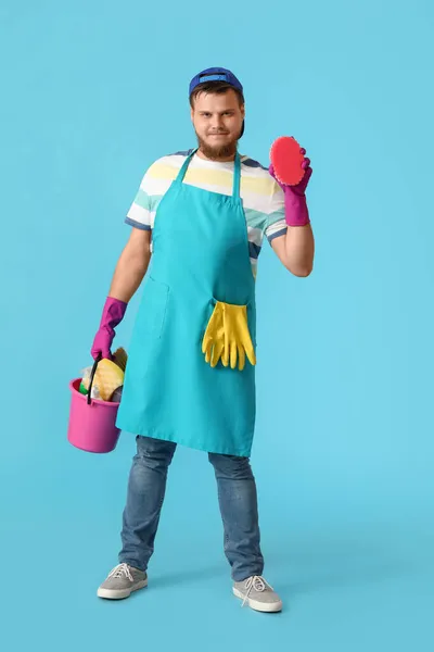 Young Man Cleaning Supplies Blue Background — Stock Photo, Image