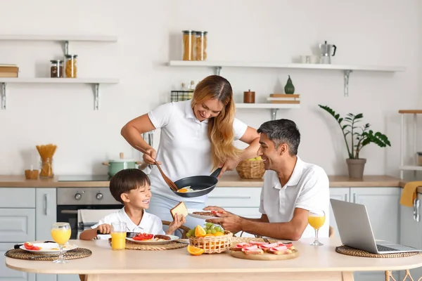 Young Woman Putting Fried Eggs Her Husband Plate Kitchen — Stock Photo, Image