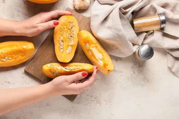 Female Hands Fresh Pumpkin Pieces Light Background — Stock Photo, Image