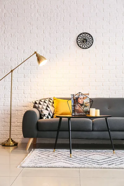 Glowing Floor Lamp Comfortable Sofa White Brick Wall — Stock Photo, Image