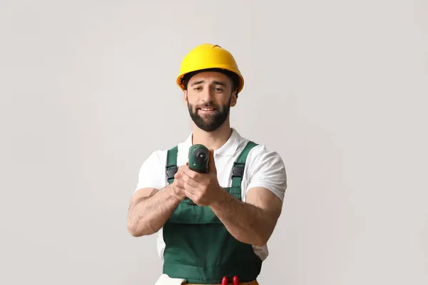 Construction Worker Hardhat Screw Gun Light Background — Stock Photo, Image