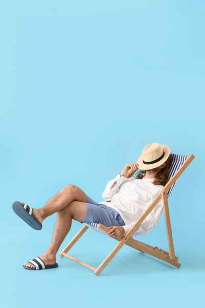 Handsome Young Man Sitting Deck Chair Color Background — Stock Photo, Image