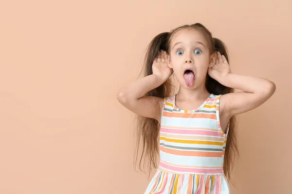 Portrait Little Girl Showing Tongue Beige Background — Stock Photo, Image