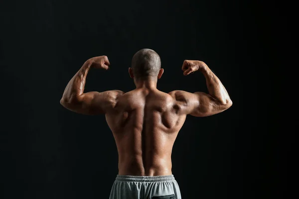 Construtor Corpo Masculino Fundo Escuro Visão Traseira — Fotografia de Stock