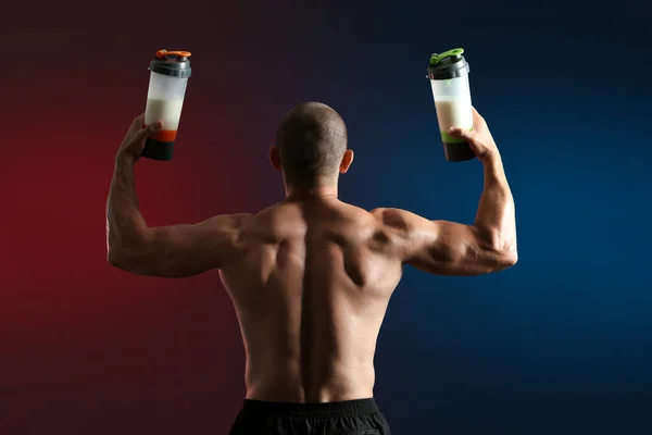 Male Bodybuilder Protein Shakes Dark Background Back View — Stock Photo, Image