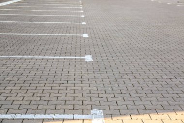 Empty parking lot with white marking lines clipart