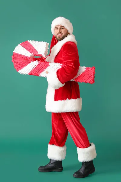 Santa Claus Med Godis Sockerrör Pinata Grön Bakgrund — Stockfoto