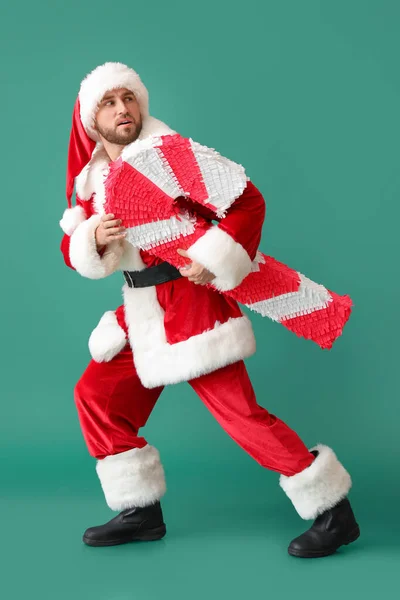 Weihnachtsmann Mit Zuckerstange Pinata Auf Grünem Hintergrund — Stockfoto