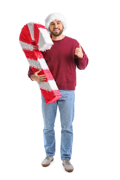 Knappe Man Santa Hoed Met Snoep Stok Pinata Tonen Duim — Stockfoto