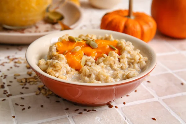 Bowl Tasty Oatmeal Pumpkin Tile Background — Stock Photo, Image