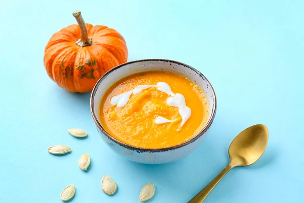 Bowl Delicious Pumpkin Cream Soup Seeds Blue Background — Stock Photo, Image