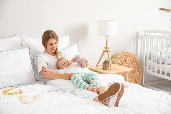 Young Mother Her Cute Little Baby Toy Lying Bed — Stock Photo, Image