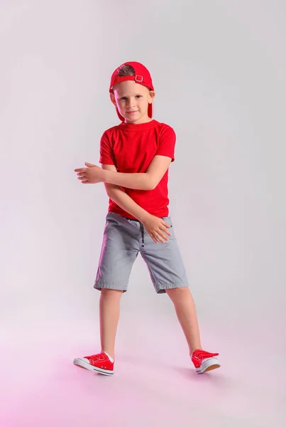 Lindo Niño Bailando Sobre Fondo Gris —  Fotos de Stock