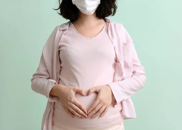 Young Pregnant Woman Medical Mask Color Background — Stock Photo, Image