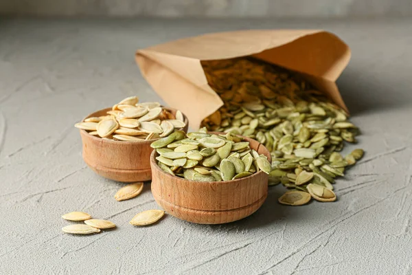 Bowls Paper Bag Pumpkin Seeds Grey Background — Stock Photo, Image