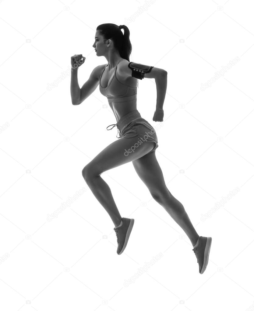 Silhouette of sporty running woman on white background