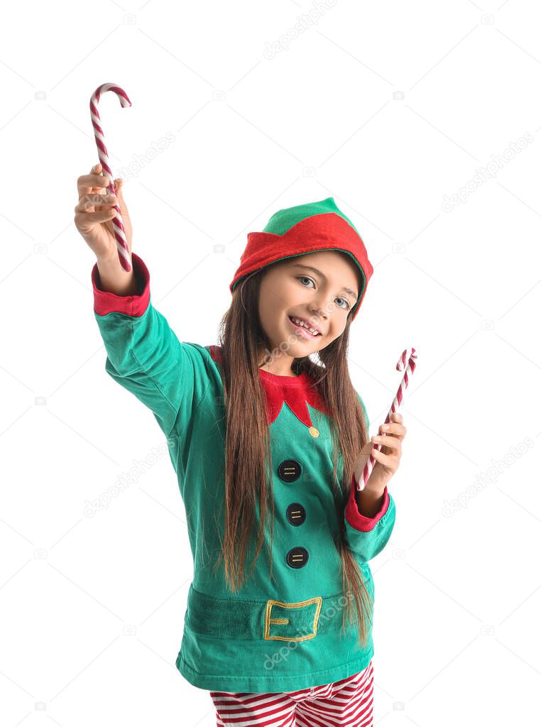 Cute little elf with candy canes on white background