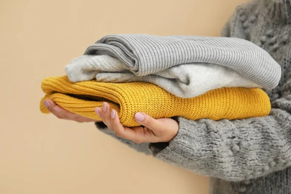 Woman Holding Stack Warm Sweaters Color Background — Stock Photo, Image