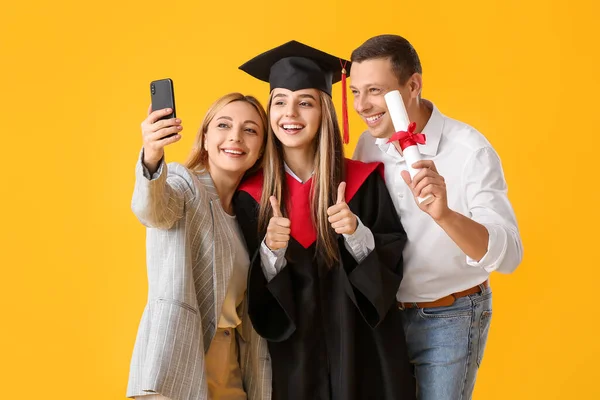 Happy Female Graduation Student Her Parents Taking Selfie Color Background — Stock Photo, Image