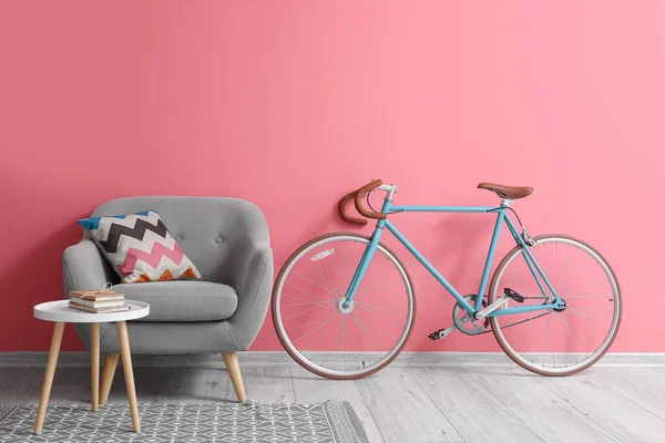 Grey Armchair Bicycle Table Books Pink Wall — Stock Photo, Image