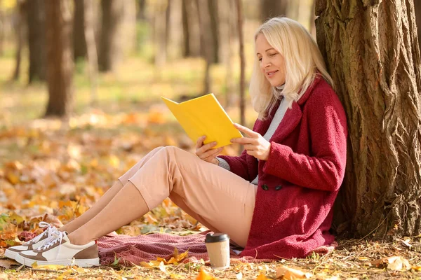 Mature Woman Reading Book Autumn Park — Stock Photo, Image