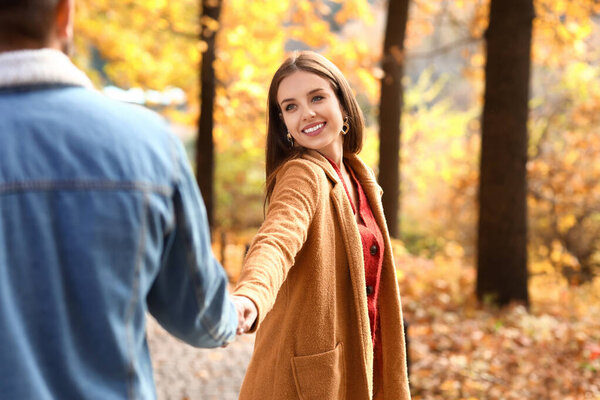 Young loving couple in autumn park