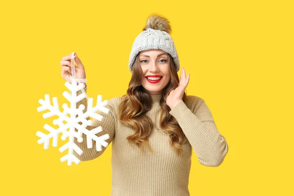 Smiling Woman Holding Big Snowflake Yellow Background — Stock Photo, Image