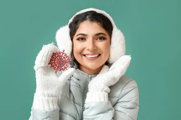 Beautiful Woman Winter Clothes Holding Red Snowflake Green Background — Stock Photo, Image