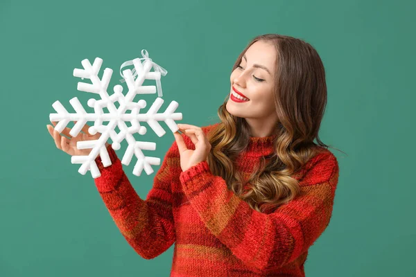 Beautiful Woman Looking Huge Snowflake Green Background — Stock Photo, Image