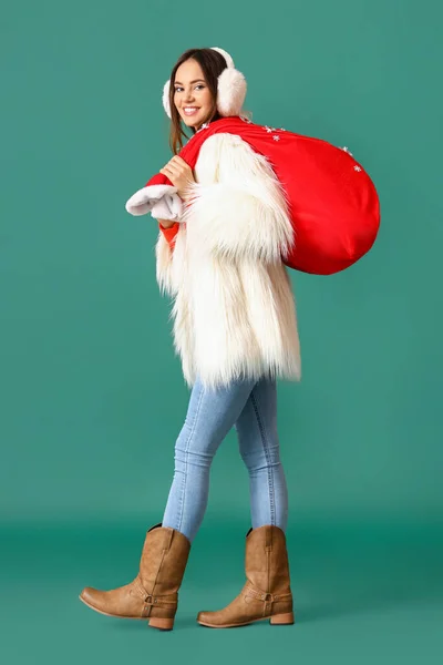 Beautiful Walking Young Woman Santa Bag Color Background — Stock Photo, Image