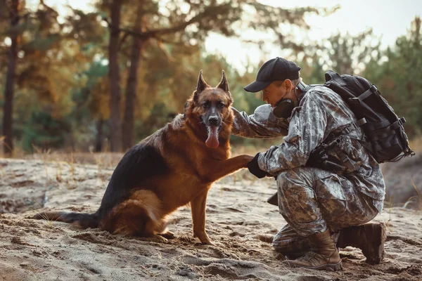 Military Working Dog Giving Paw Soldier Outdoors — Stock Photo, Image