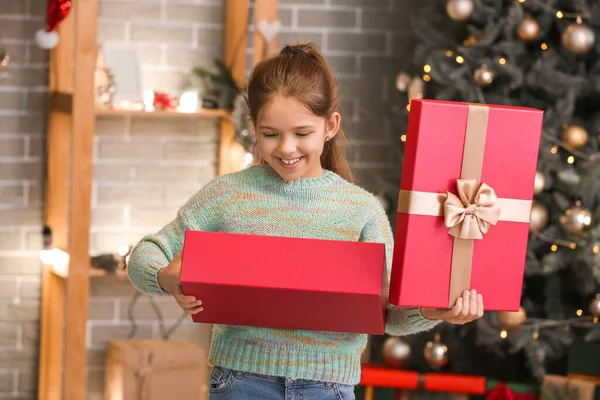 Cute Girl Opening Christmas Gift Home — Stock Photo, Image