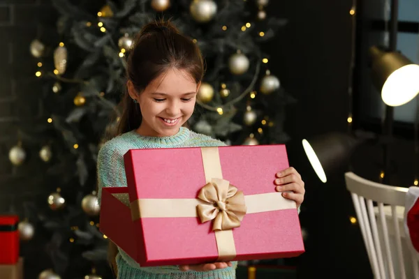 Cute Girl Opening Christmas Gift Home — Stock Photo, Image