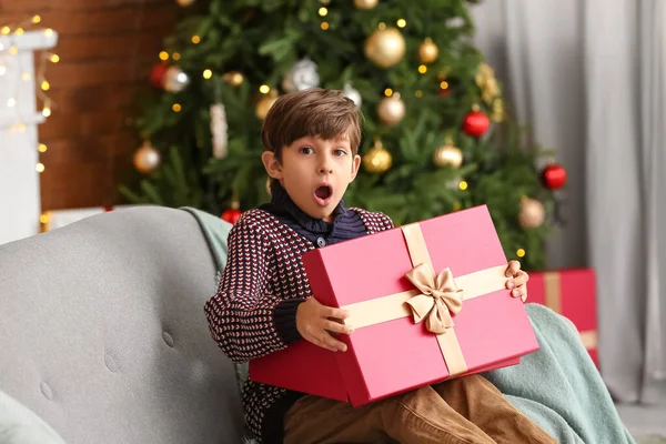 Surprised Little Boy Opening Christmas Gift Home — Stock Photo, Image