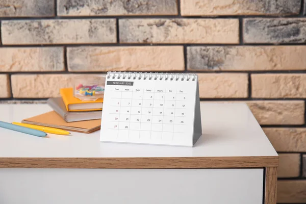 Paper Calendar February 2022 Stationery Supplies Chest Drawers Brick Wall — Stock Photo, Image