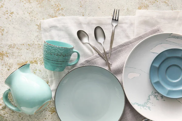 Set Stylish Dinnerware Light Grunge Background — Stock Photo, Image