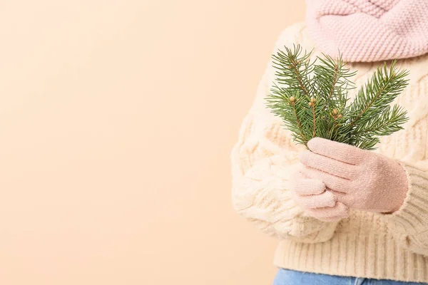Young Woman Warm Clothes Holding Fir Tree Branches Beige Background — Stock Photo, Image