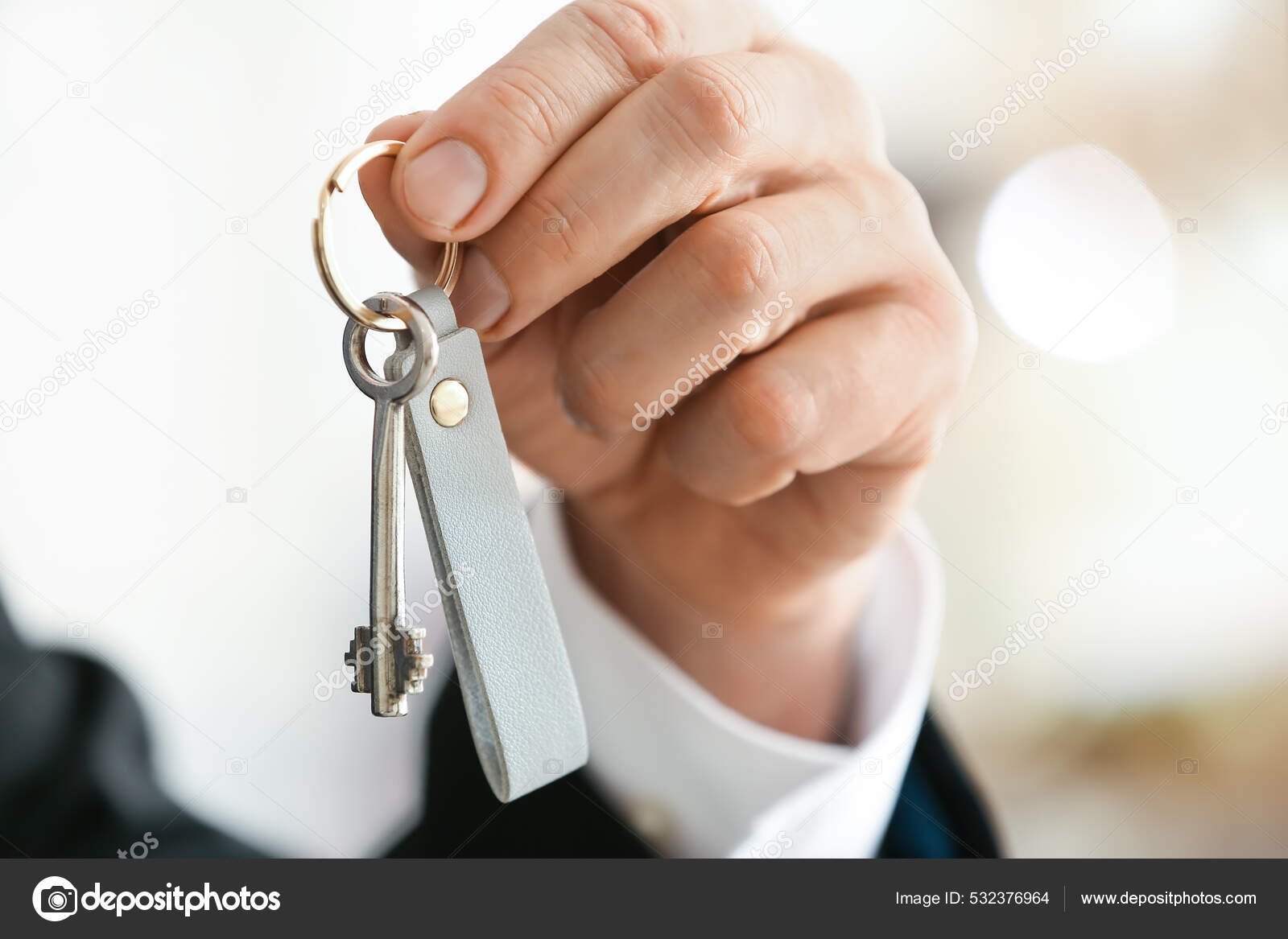 Male Hand Holding Key Chain Stock Photo by ©serezniy 532376964