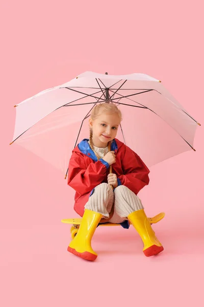 Little Girl Stylish Raincoat Umbrella Skateboard Color Background — Stock Photo, Image