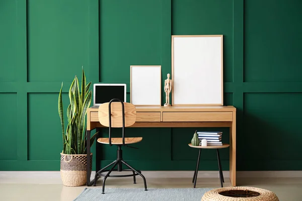 Modern Workplace Laptop Mannequin Blank Frames Green Wall — Stock Photo, Image