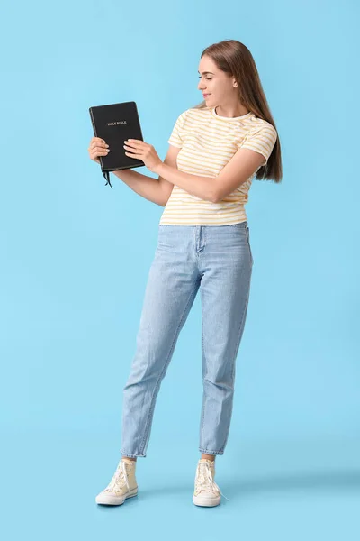 Pretty Young Woman Holy Bible Blue Background — Stock Photo, Image