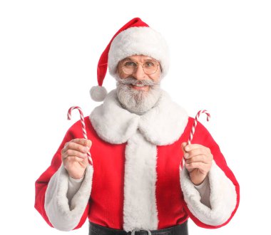 Beyaz arka planda şeker kamışları olan Noel Baba