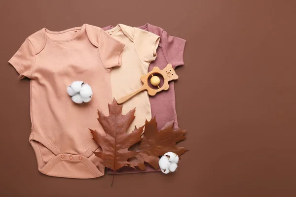 Set Baby Clothes Toy Cotton Flowers Autumn Leaves Color Background — Stock Photo, Image