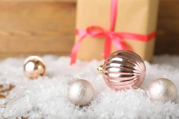 Christmas Balls Heap Snow Wooden Background Closeup — Stock Photo, Image