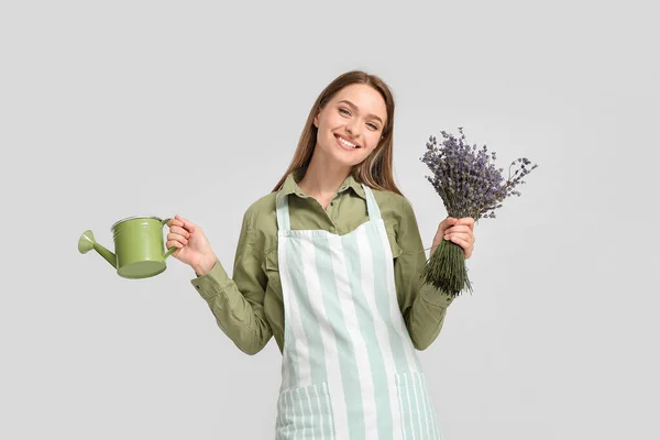 Female Gardener Lavender Watering Can Light Background — Stock Photo, Image