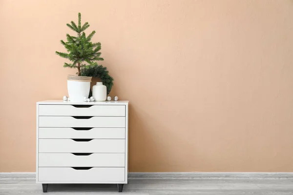 Beautiful Christmas Tree Pot Decor Chest Drawers Beige Wall — Stock Photo, Image