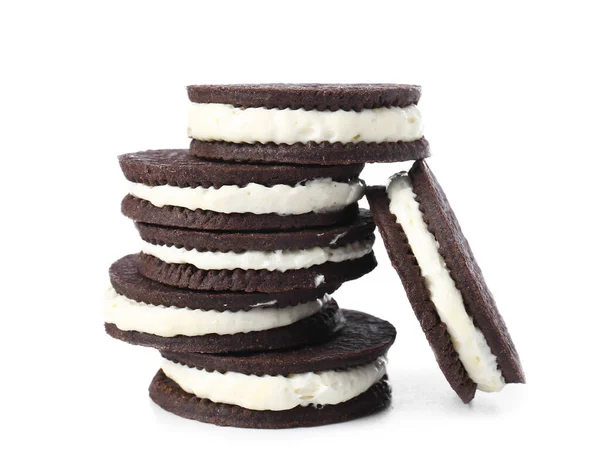 Tasty chocolate cookies with cream on white background