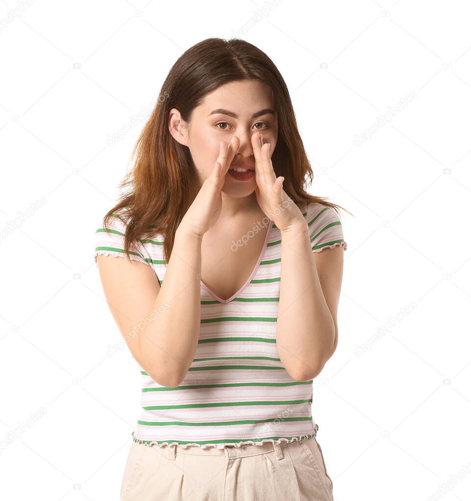 Young gossiping Asian woman on white background
