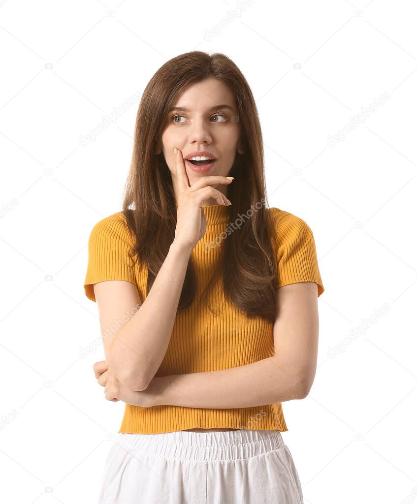 Thoughtful young woman on white background