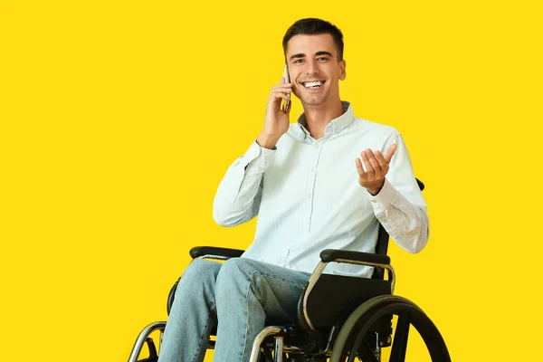 Young Man Wheelchair Talking Phone Color Background — Stock Photo, Image